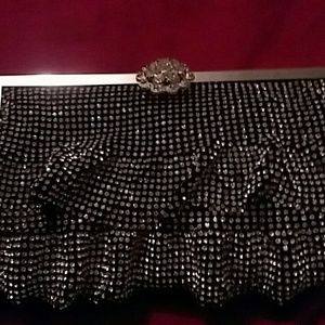 A sparkly black clutch